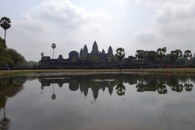 Siem Reap on the bank of a river, with the image reflected in the water